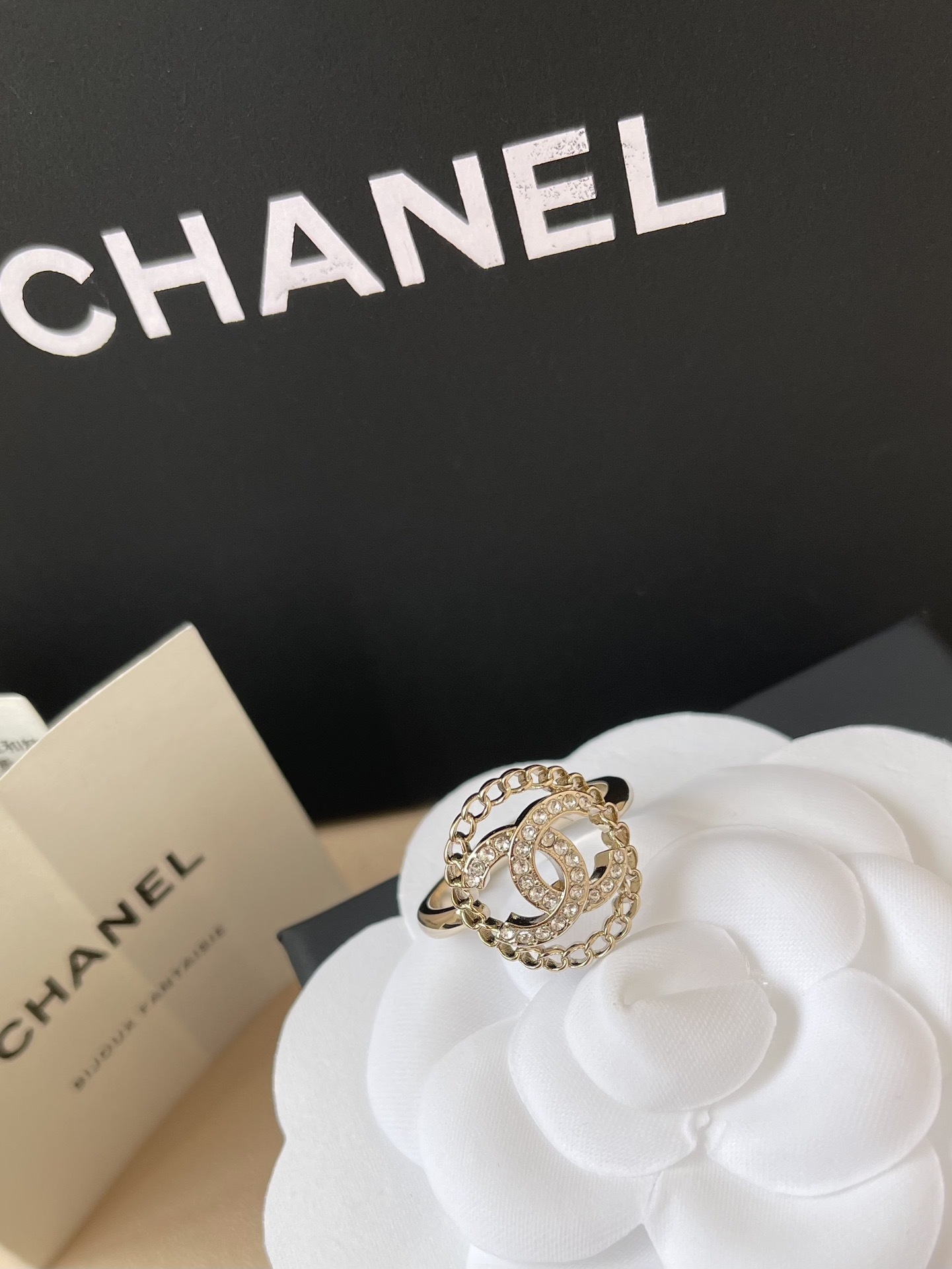 Chanel CC Logo Crystal Ring with Chain Border - Elegant Luxury