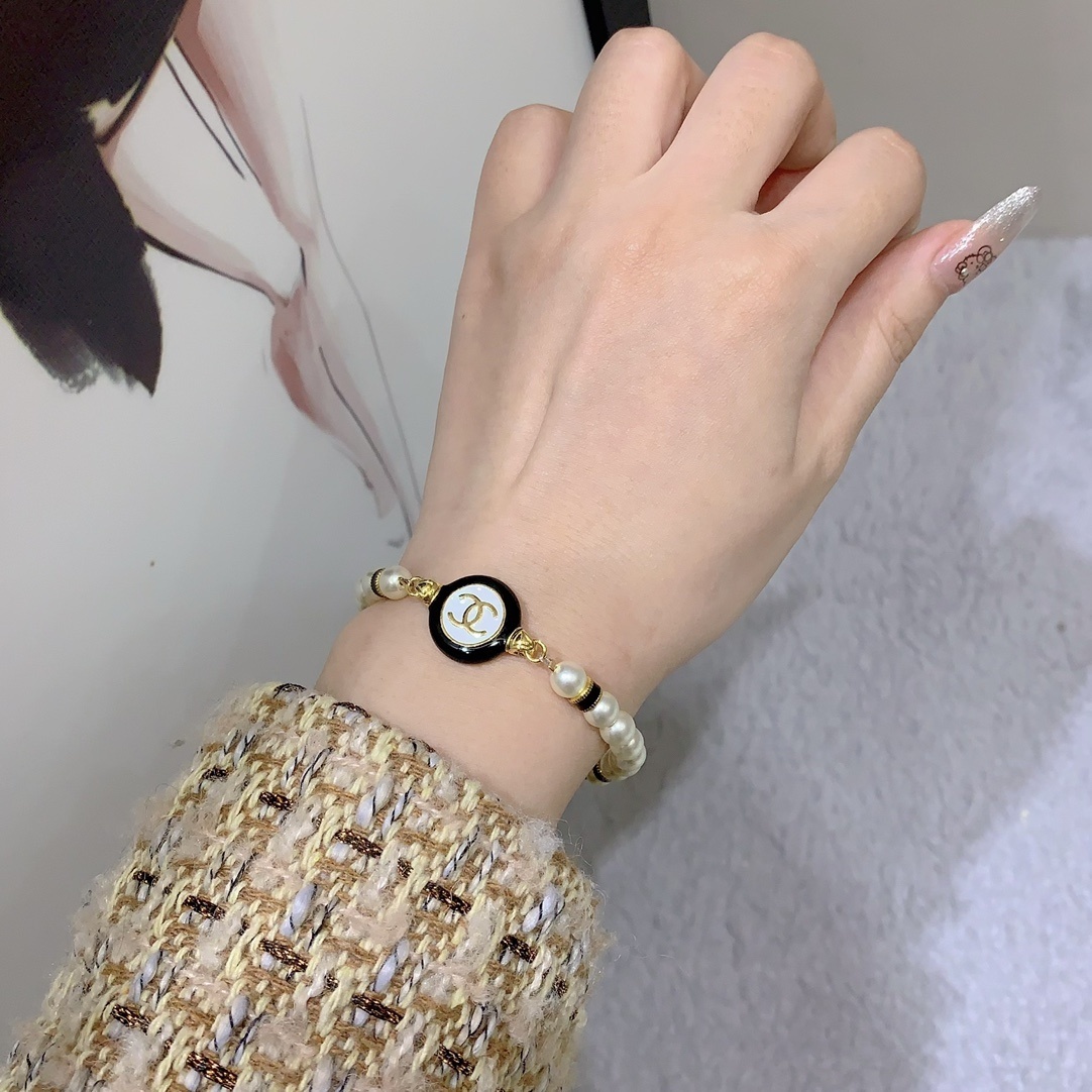 Chanel Pearl Bracelet with Black & White Enamel CC Logo - Gold Tone