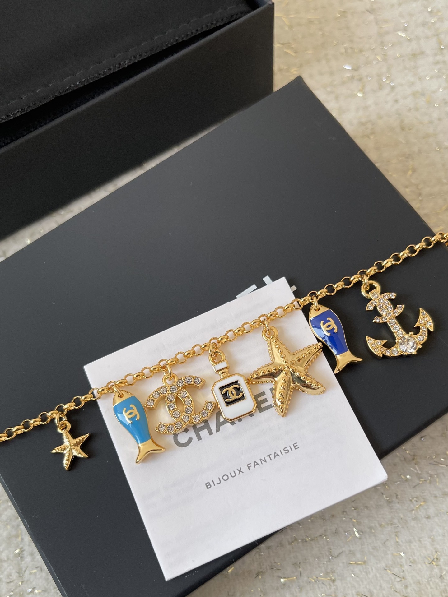 Luxury Gold Marine Charm Bracelet with Starfish and CC Logo