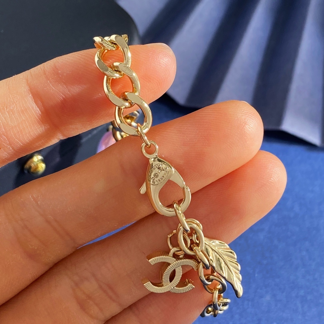 Elegant Gold Link Bracelet with Pink Crystal Charm and CC Logo