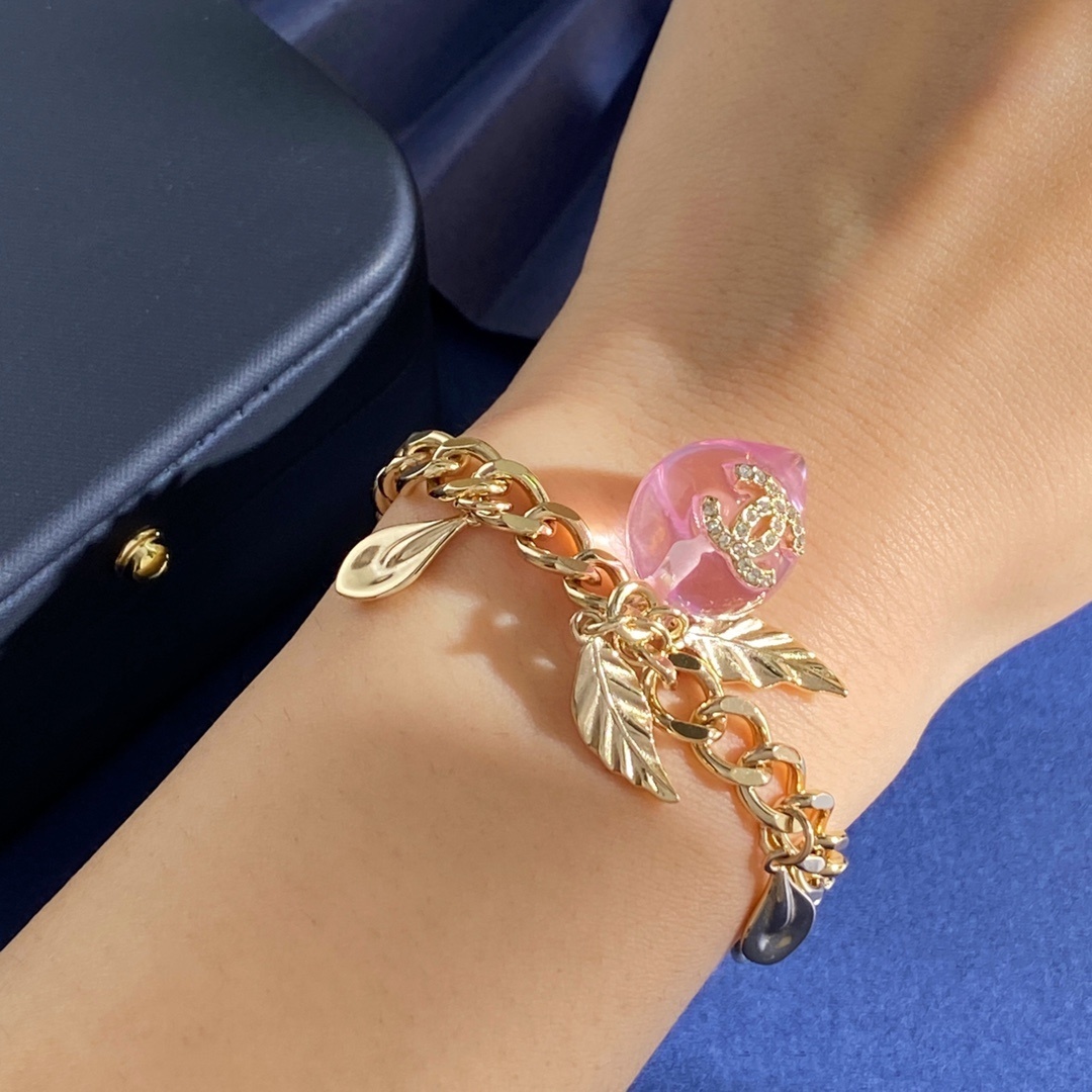 Elegant Gold Link Bracelet with Pink Crystal Charm and CC Logo