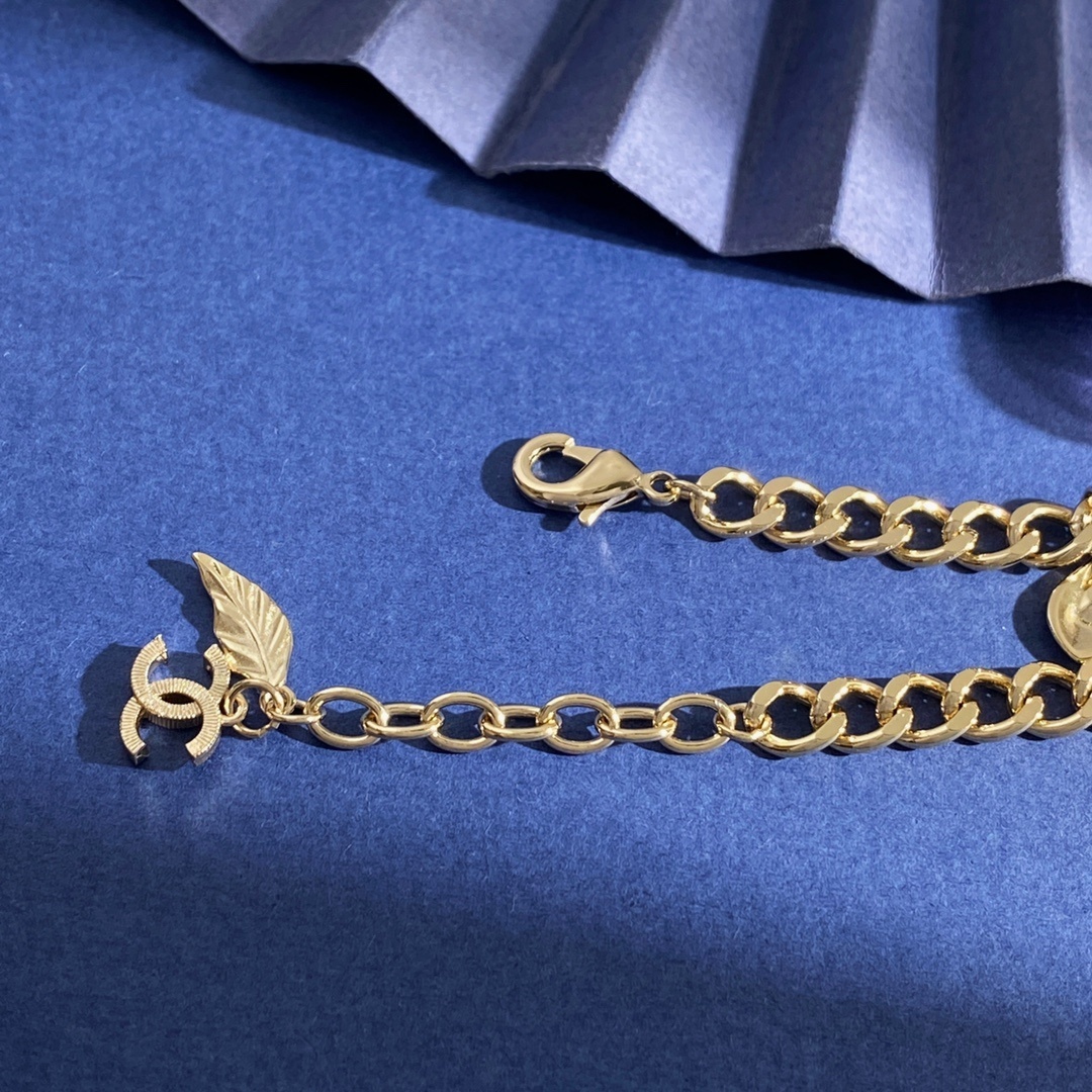 Elegant Gold Link Bracelet with Pink Crystal Charm and CC Logo