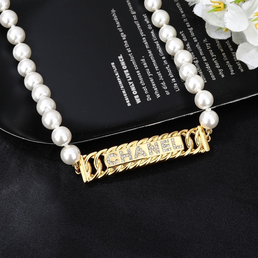 Elegant Chanel Faux Pearl Belt with Gold-Tone Crystal Logo