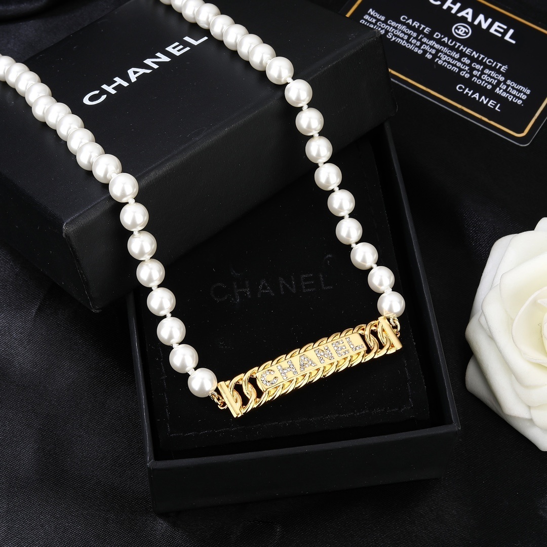 Elegant Chanel Faux Pearl Belt with Gold-Tone Crystal Logo