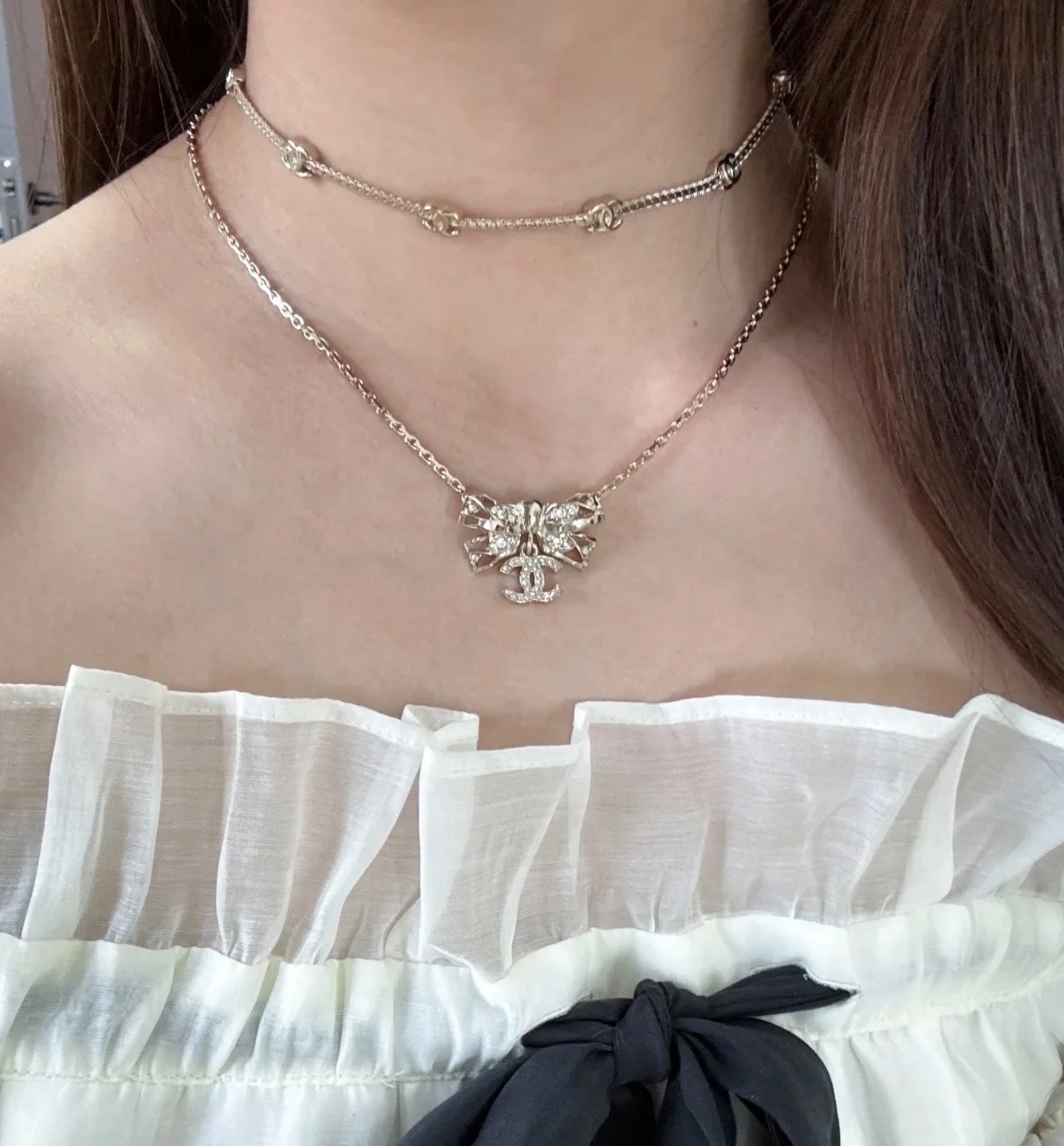 Elegant Gold Ribbon Bow Necklace with Sparkling CC Pendant