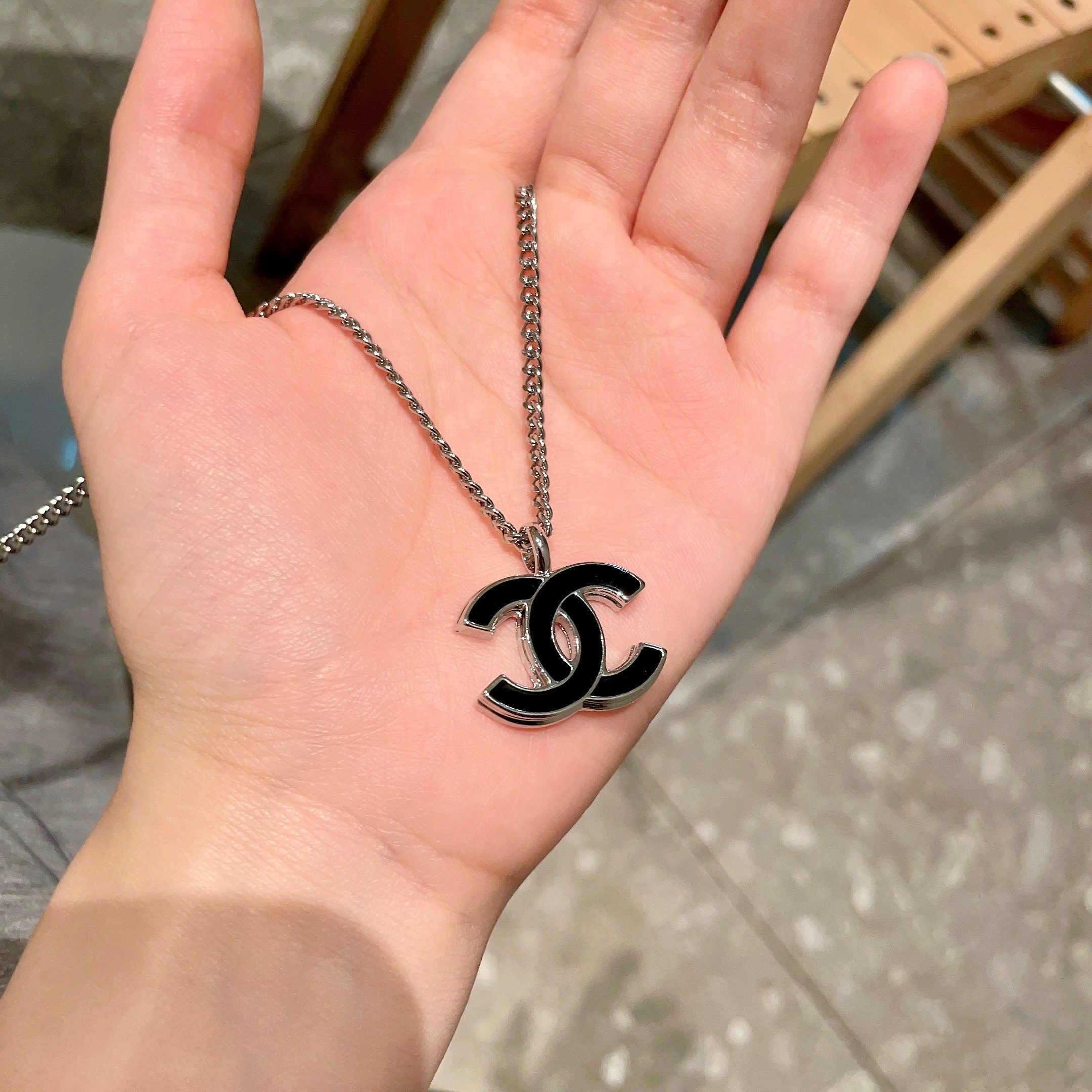 Elegant Silver CC Pendant Necklace with Black Enamel Inlay