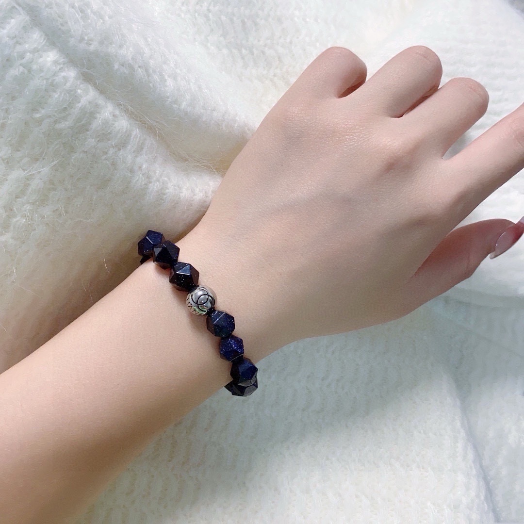 Blue Sandstone Faceted Bead Bracelet with Silver Logo Charm