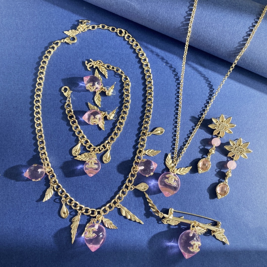 Elegant Gold Pink Peach Crystal Charm Bracelet with Leaf Accents