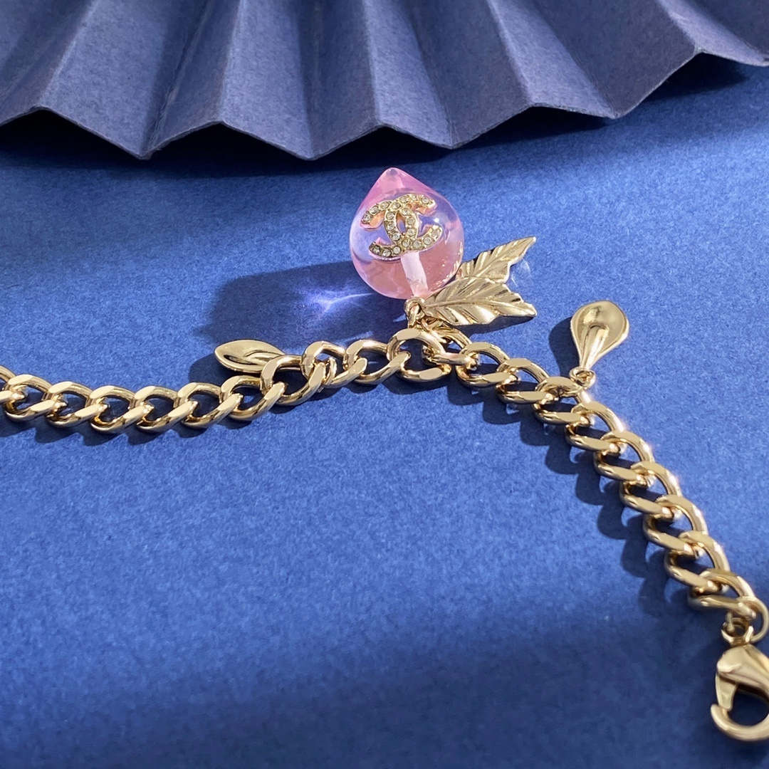 Elegant Gold Pink Peach Crystal Charm Bracelet with Leaf Accents