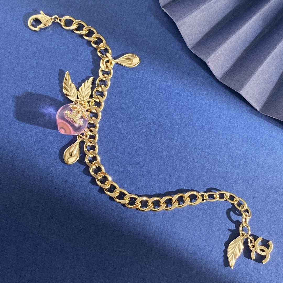 Elegant Gold Pink Peach Crystal Charm Bracelet with Leaf Accents