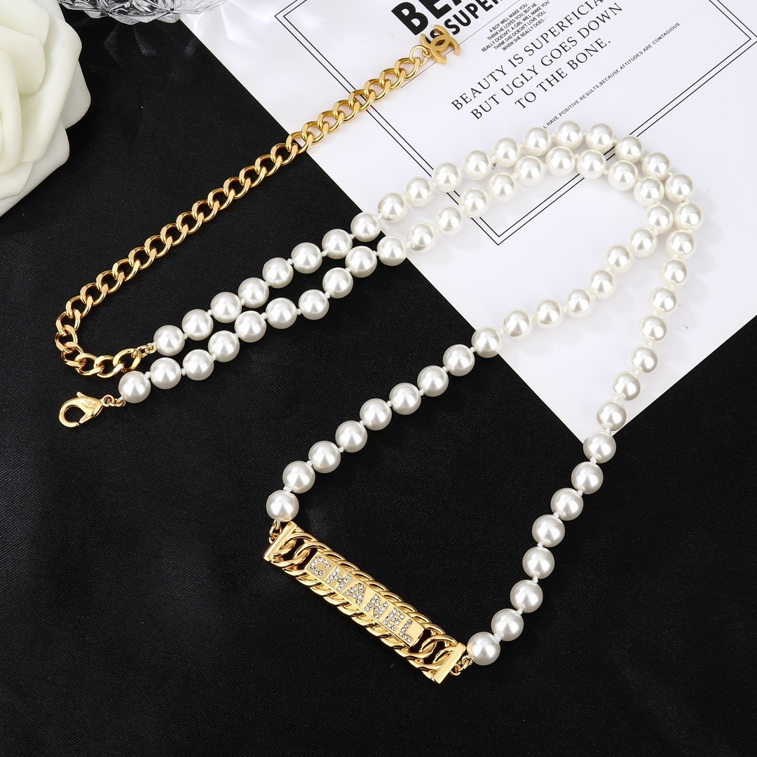 Elegant Chanel Pearl Waist Belt with Gold Crystal Logo Plaque