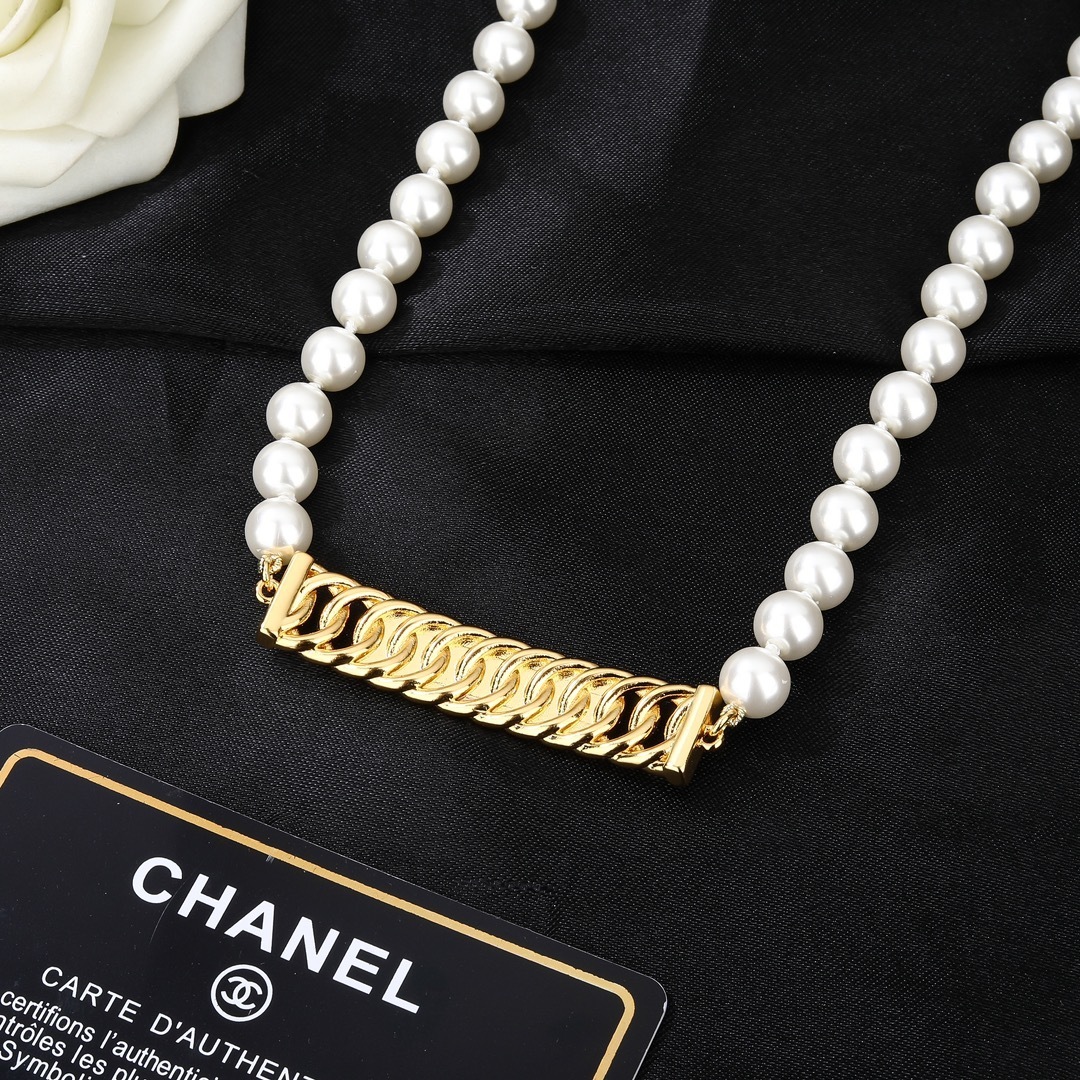 Elegant Chanel Pearl Waist Belt with Gold Crystal Logo Plaque