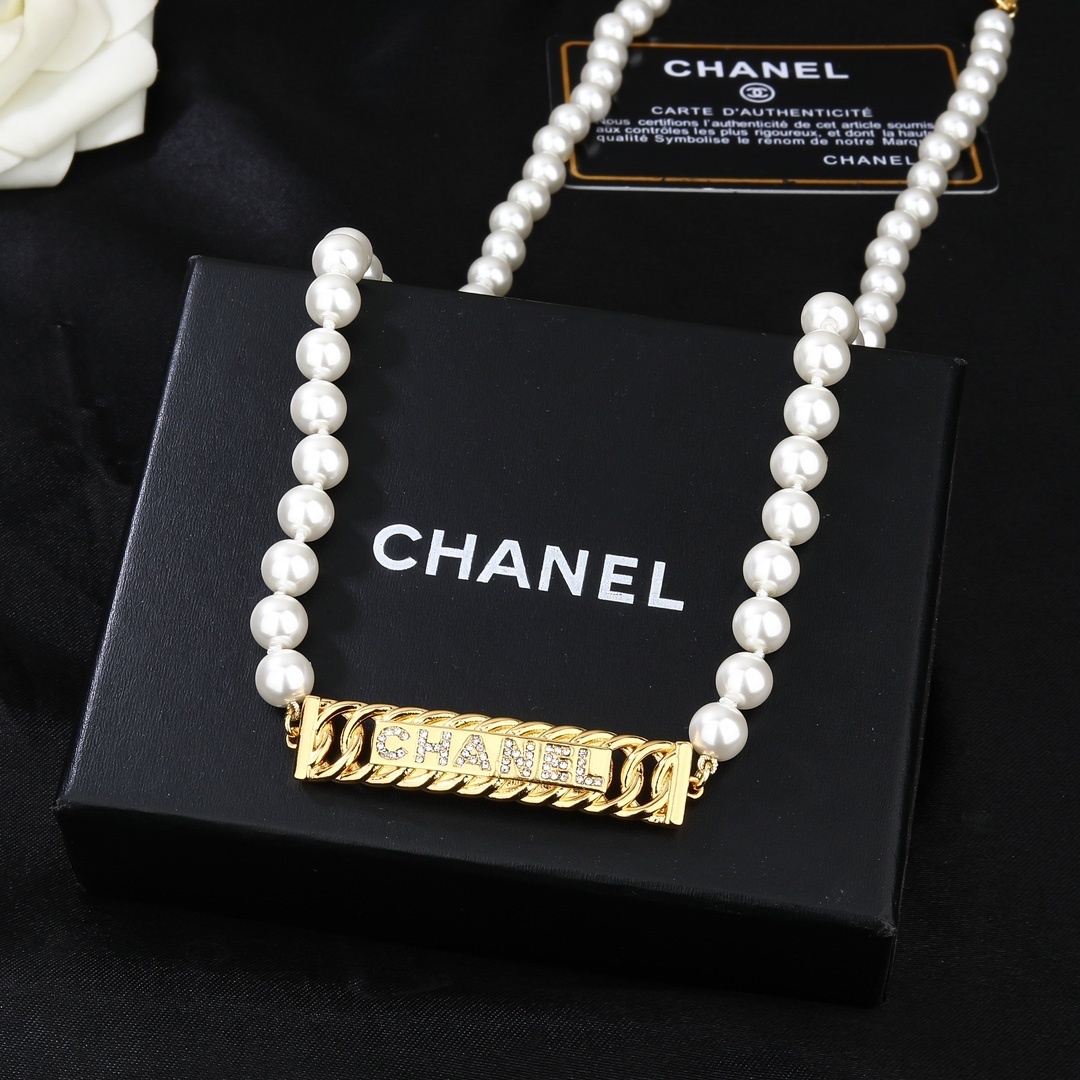Elegant Chanel Pearl Waist Belt with Gold Crystal Logo Plaque