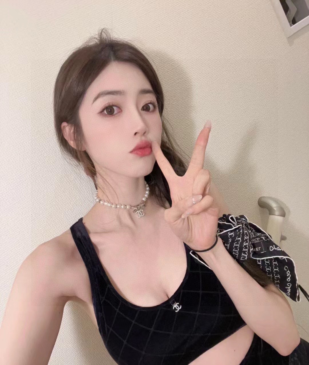 Chanel Elegant Pearl Necklace with Crystal Bow and CC Logo Charm