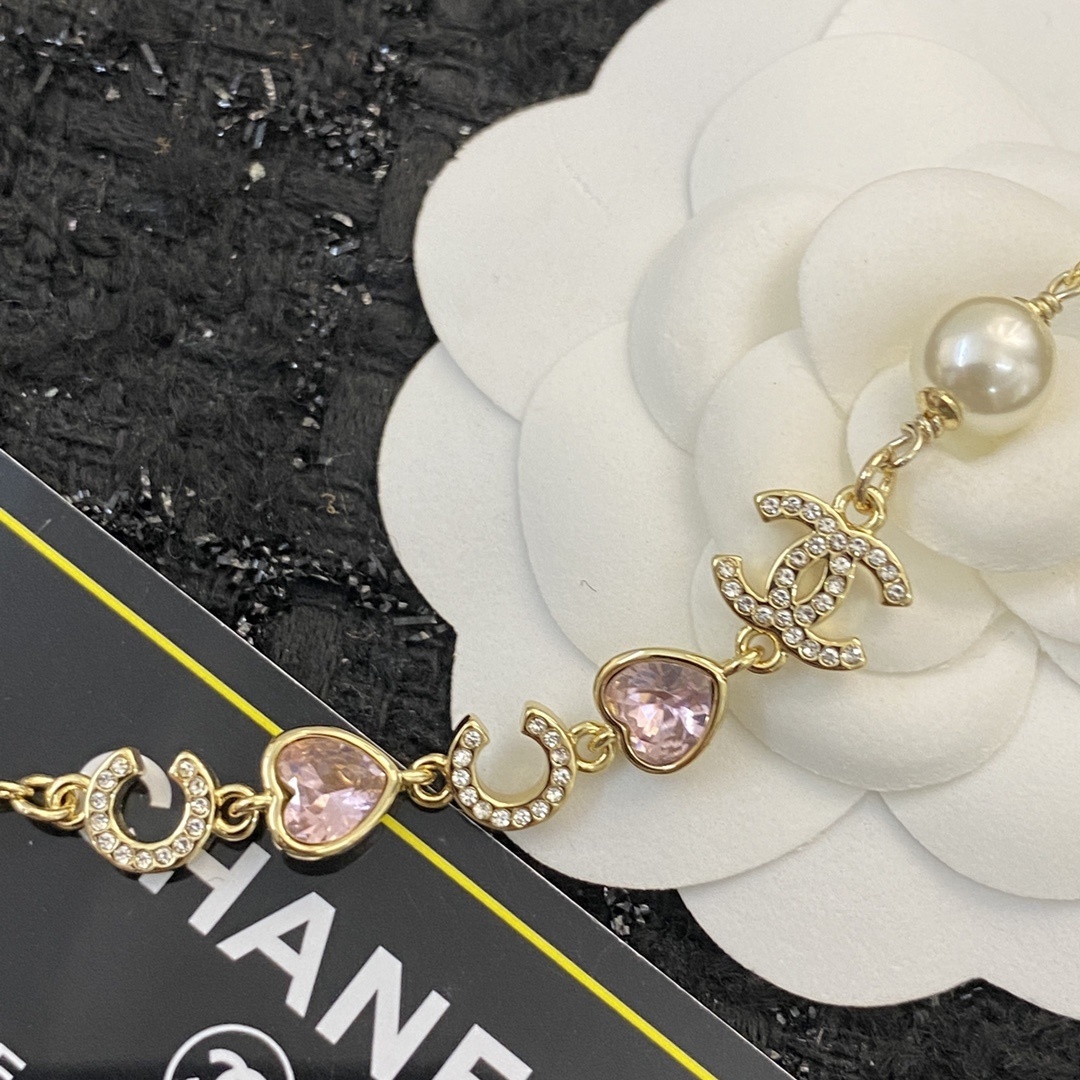 Elegant Gold Pearl Necklace with CC Charms and Pink Crystal Hearts