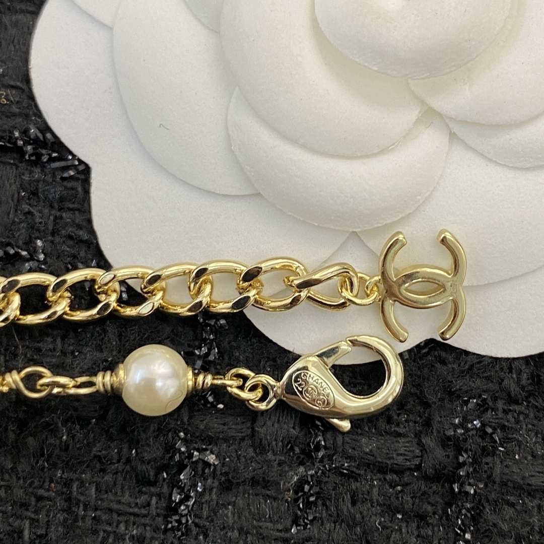 Elegant Gold Pearl Necklace with CC Charms and Pink Crystal Hearts