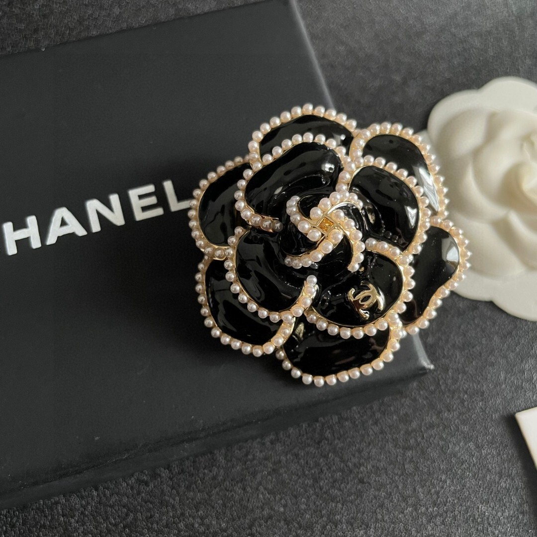 Elegant Black Camellia Flower Brooch with Pearl Trim & Gold Logo