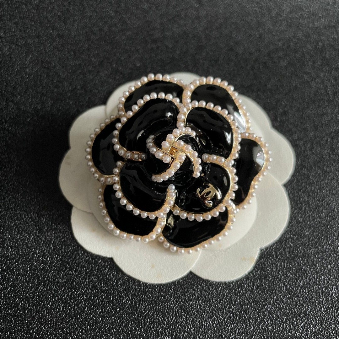 Elegant Black Camellia Flower Brooch with Pearl Trim & Gold Logo