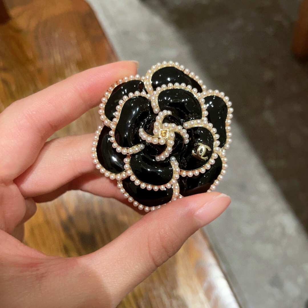 Elegant Black Camellia Flower Brooch with Pearl Trim & Gold Logo