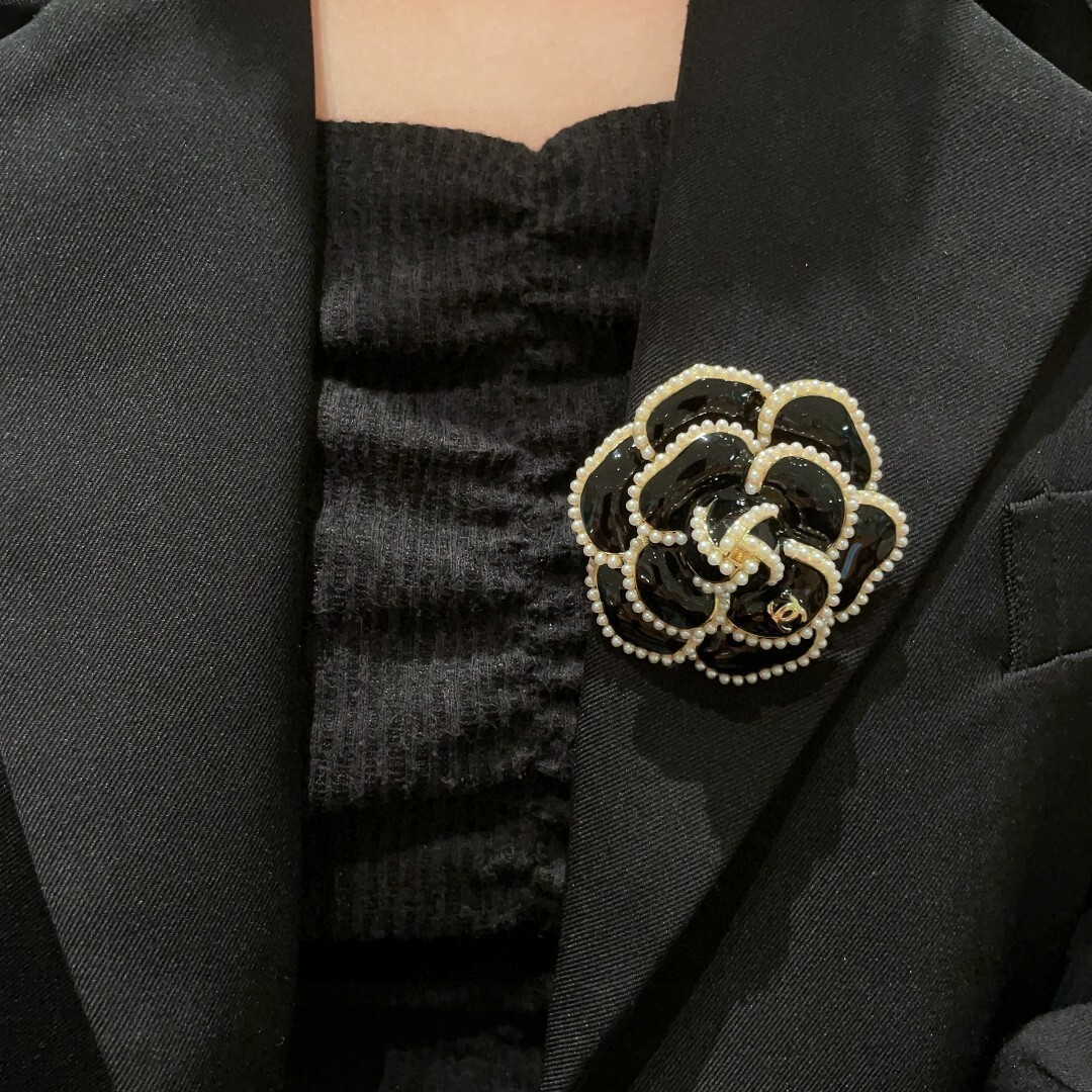 Elegant Black Camellia Flower Brooch with Pearl Trim & Gold Logo