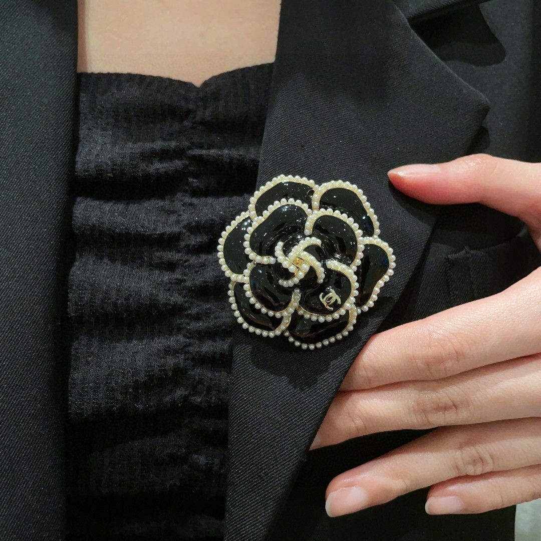 Elegant Black Camellia Flower Brooch with Pearl Trim & Gold Logo