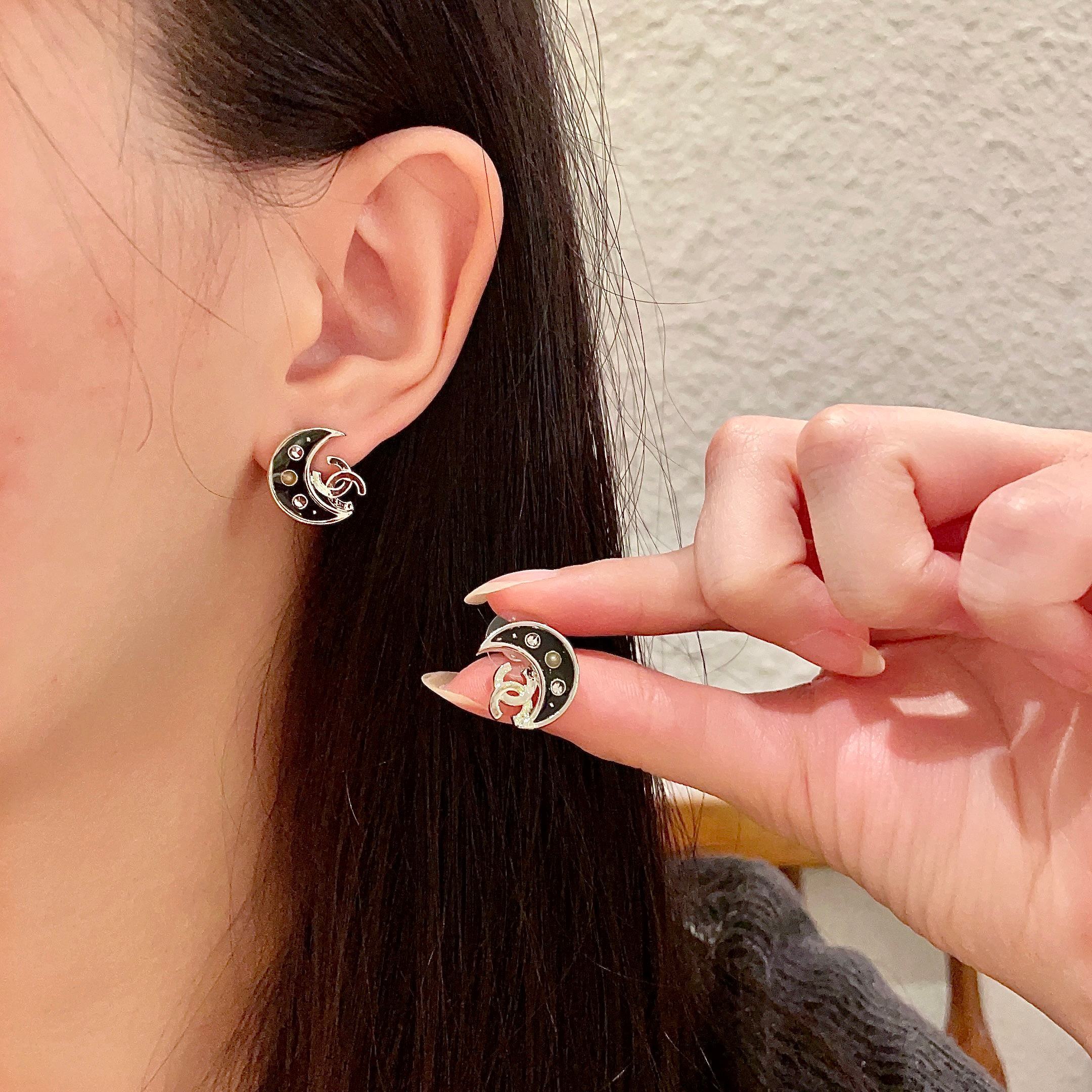 Luxury Black Crescent Moon Stud Earrings with Interlocking Logo