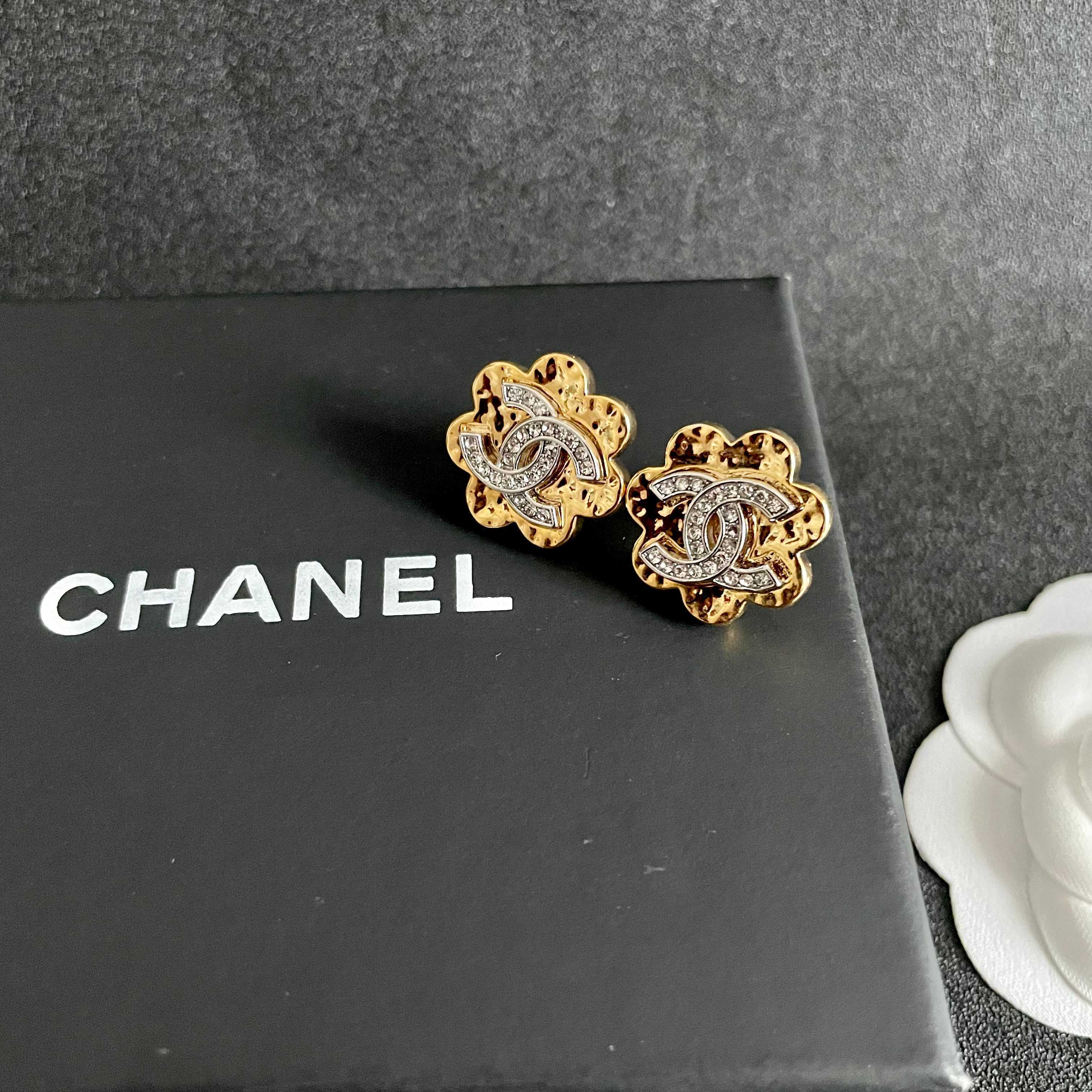 Elegant Gold Flower Stud Earrings with Crystal Logo Detail