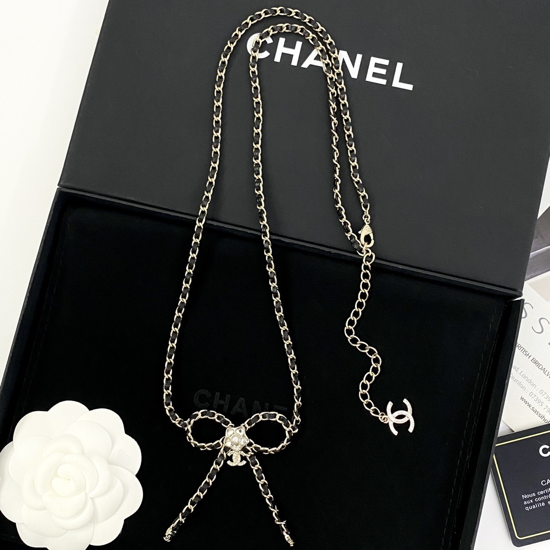 Elegant Crystal Bow Long Necklace with Interwoven Leather Chain