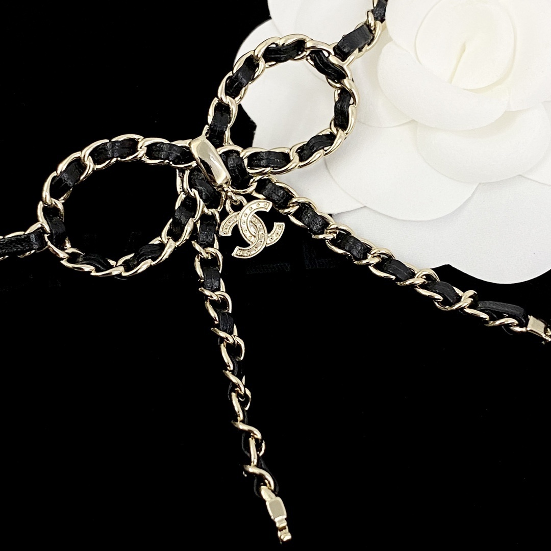 Elegant Crystal Bow Long Necklace with Interwoven Leather Chain