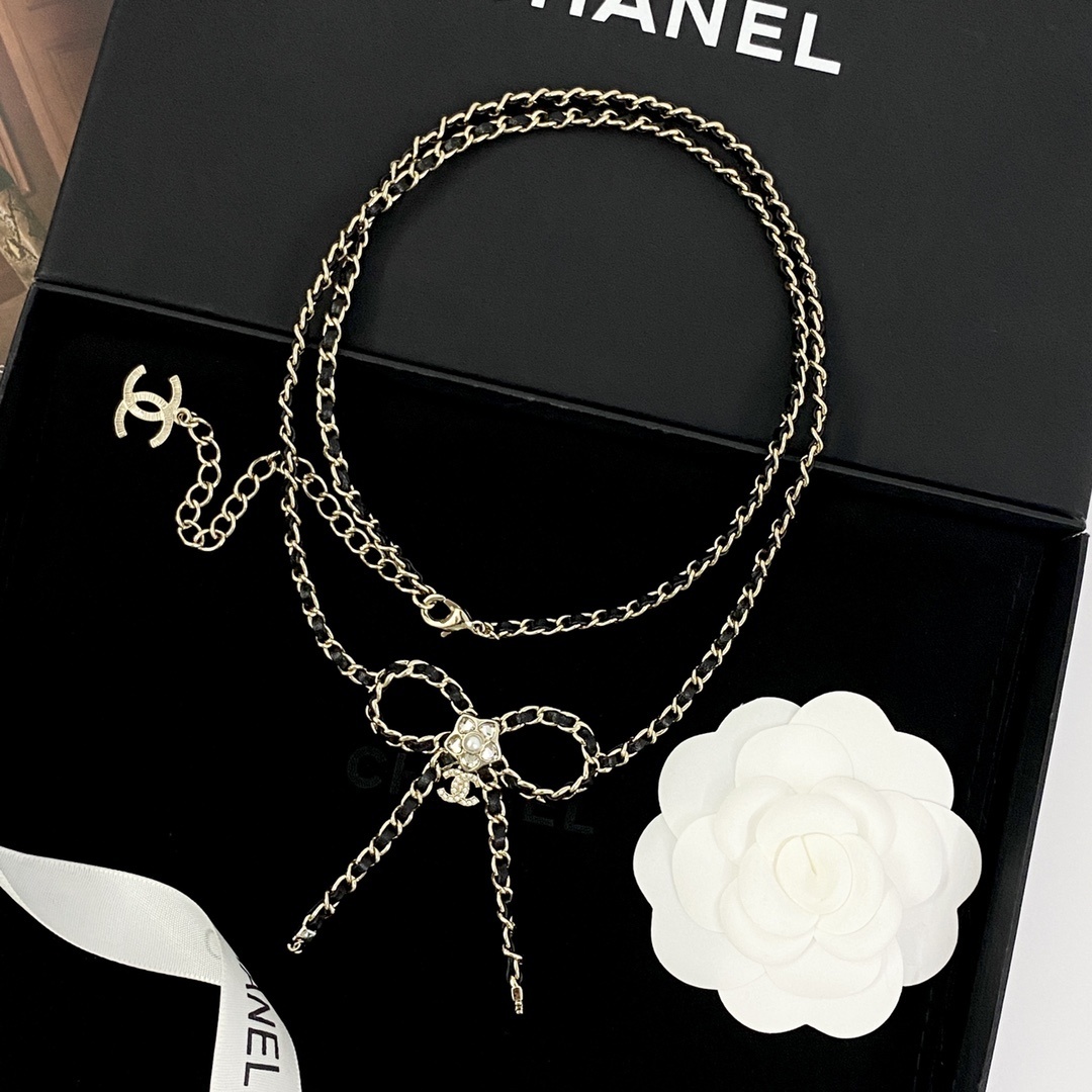 Elegant Crystal Bow Long Necklace with Interwoven Leather Chain