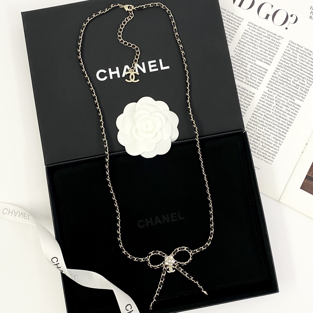 Elegant Crystal Bow Long Necklace with Interwoven Leather Chain