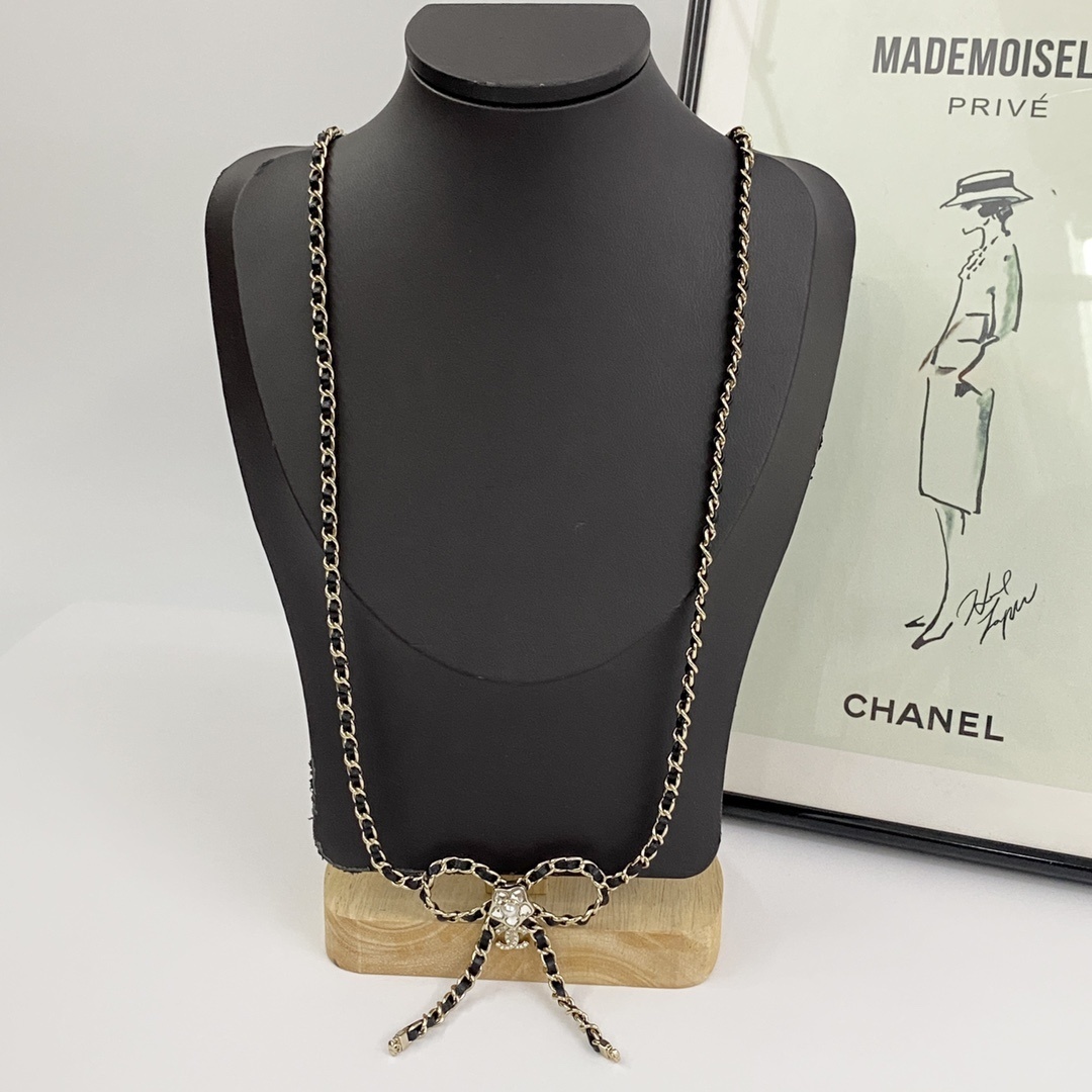 Elegant Crystal Bow Long Necklace with Interwoven Leather Chain