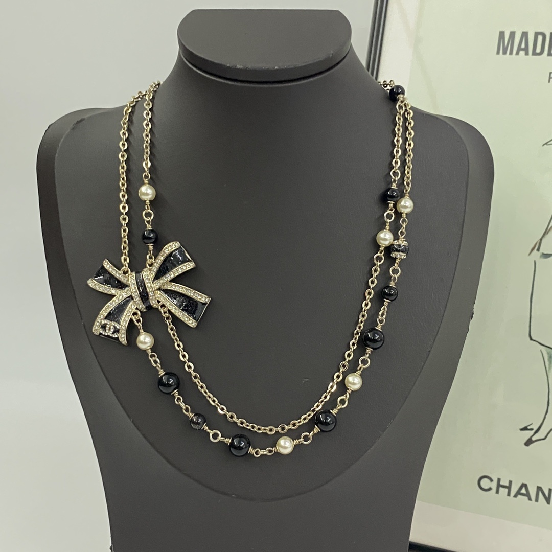 Luxury Double Strand Pearl Necklace with Black Crystal Bow Pendant