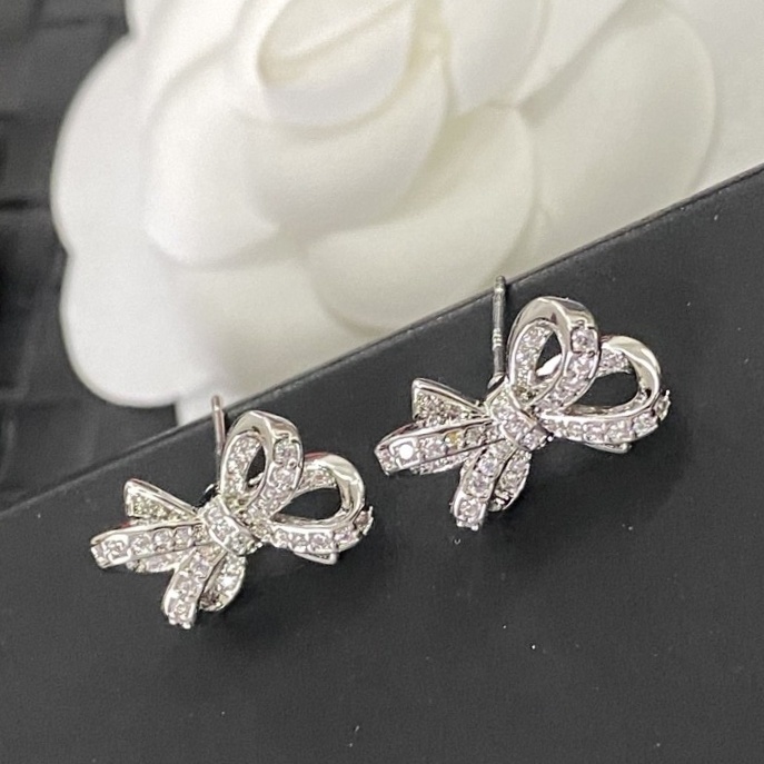 Luxury Chanel Silver Bow Earrings with Sparkling Crystals