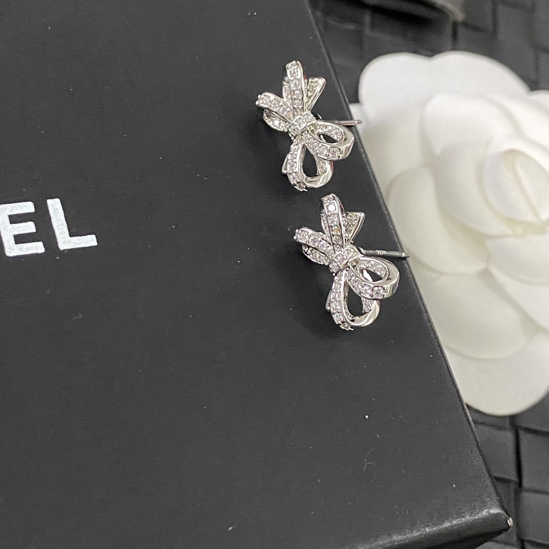 Luxury Chanel Silver Bow Earrings with Sparkling Crystals