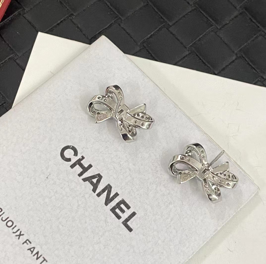 Luxury Chanel Silver Bow Earrings with Sparkling Crystals