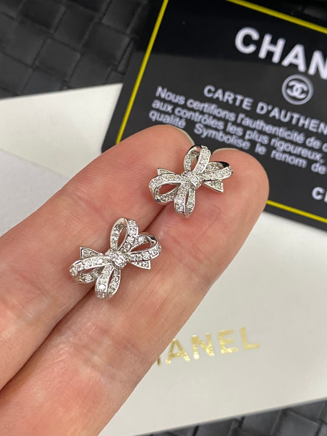 Luxury Chanel Silver Bow Earrings with Sparkling Crystals