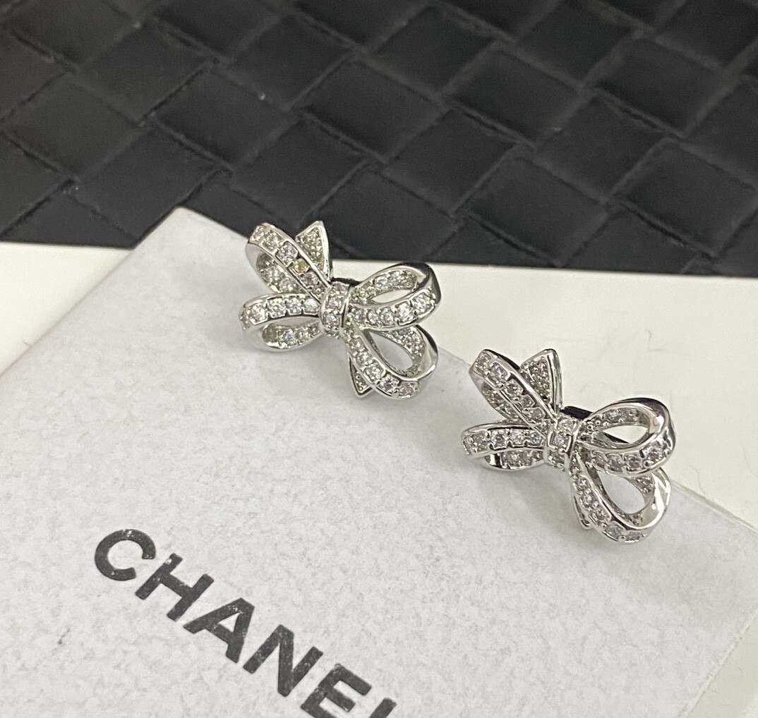 Luxury Chanel Silver Bow Earrings with Sparkling Crystals