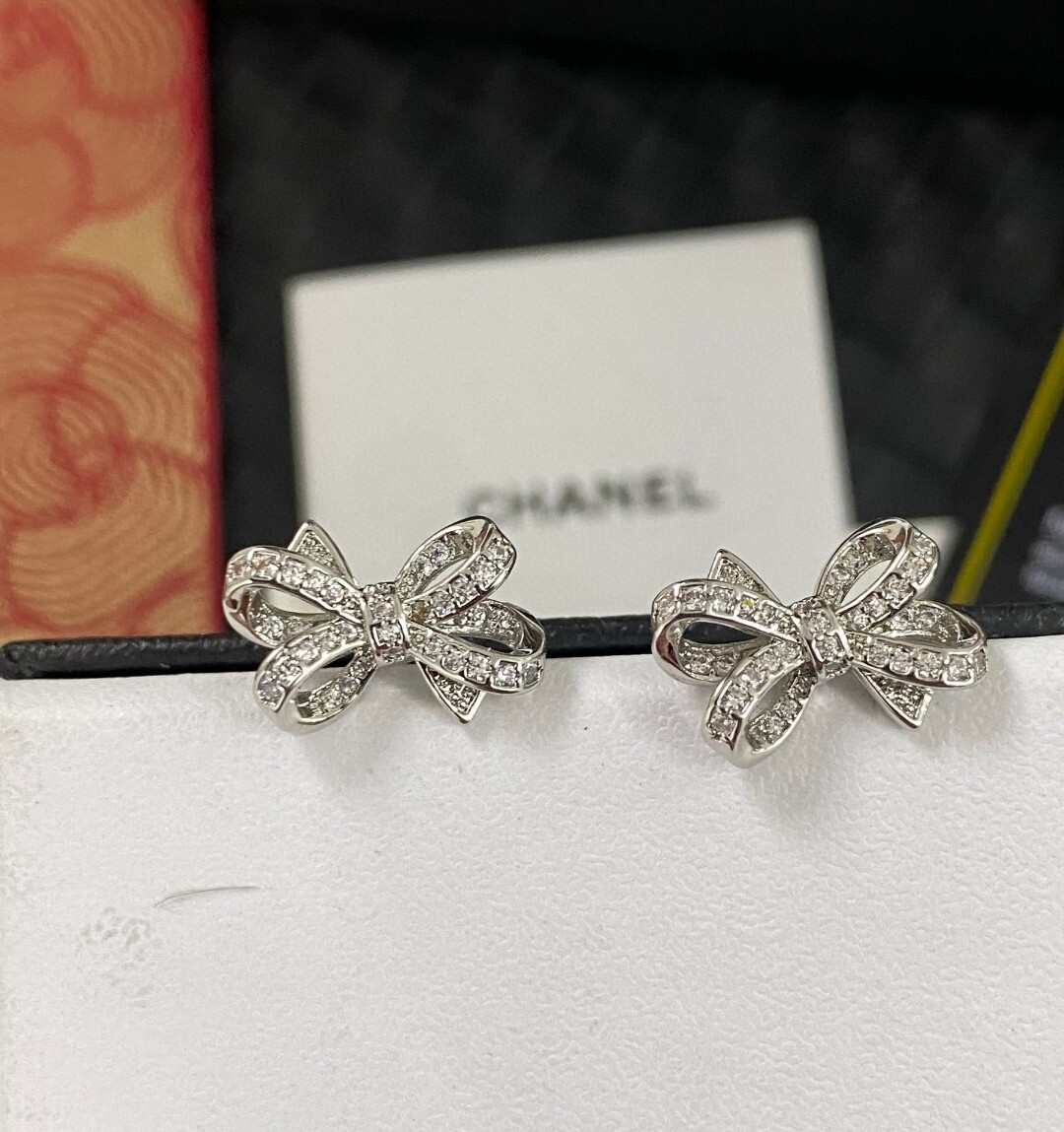 Luxury Chanel Silver Bow Earrings with Sparkling Crystals