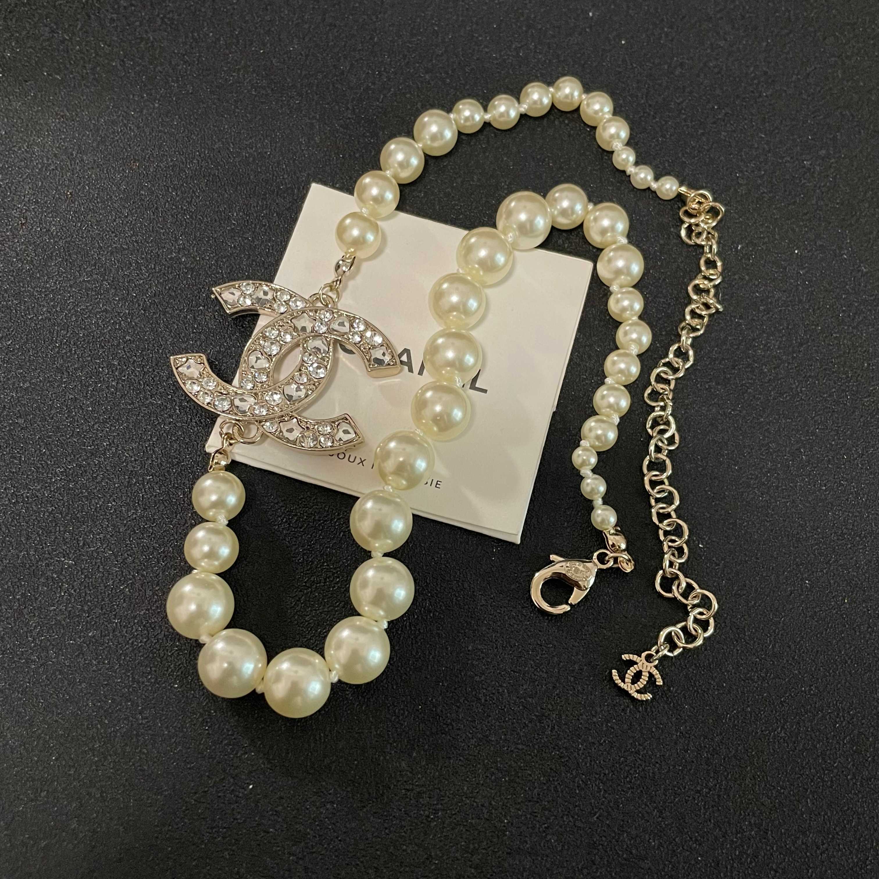 Elegant Pearl Necklace with Sparkling Crystal CC Logo Pendant