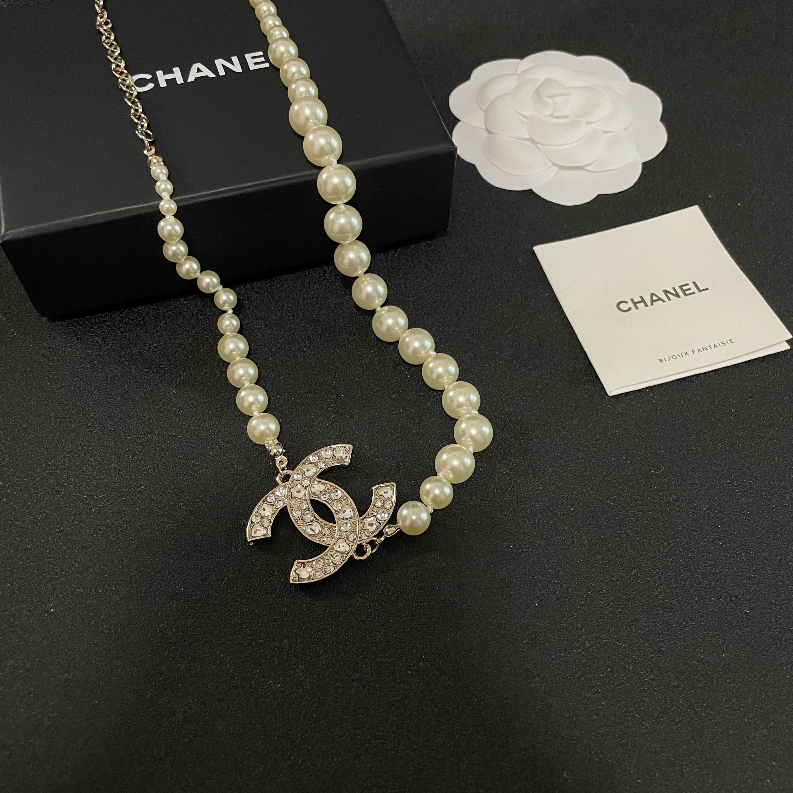 Elegant Pearl Necklace with Sparkling Crystal CC Logo Pendant