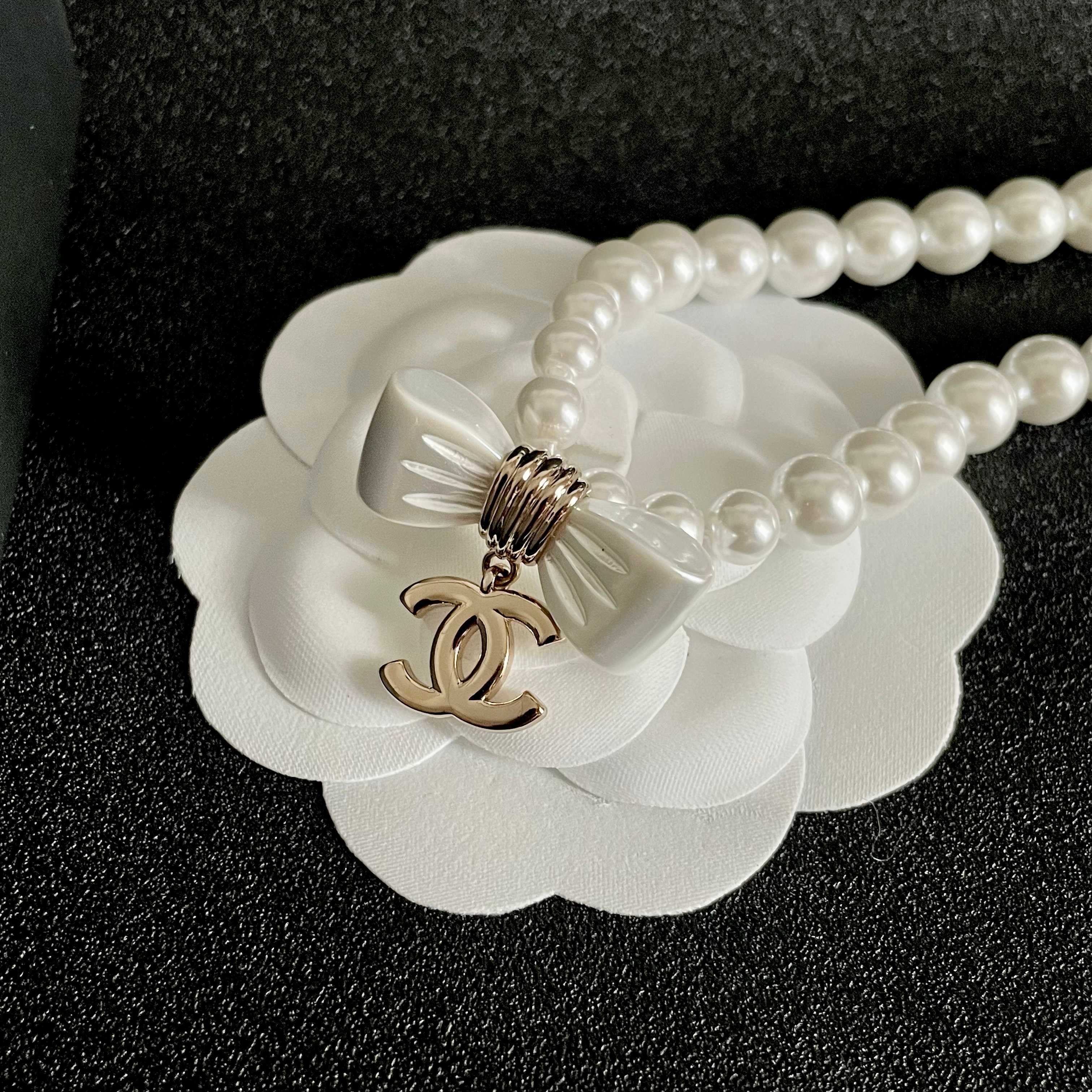 Elegant Pearl Choker Necklace with White Bow and Gold CC Pendant