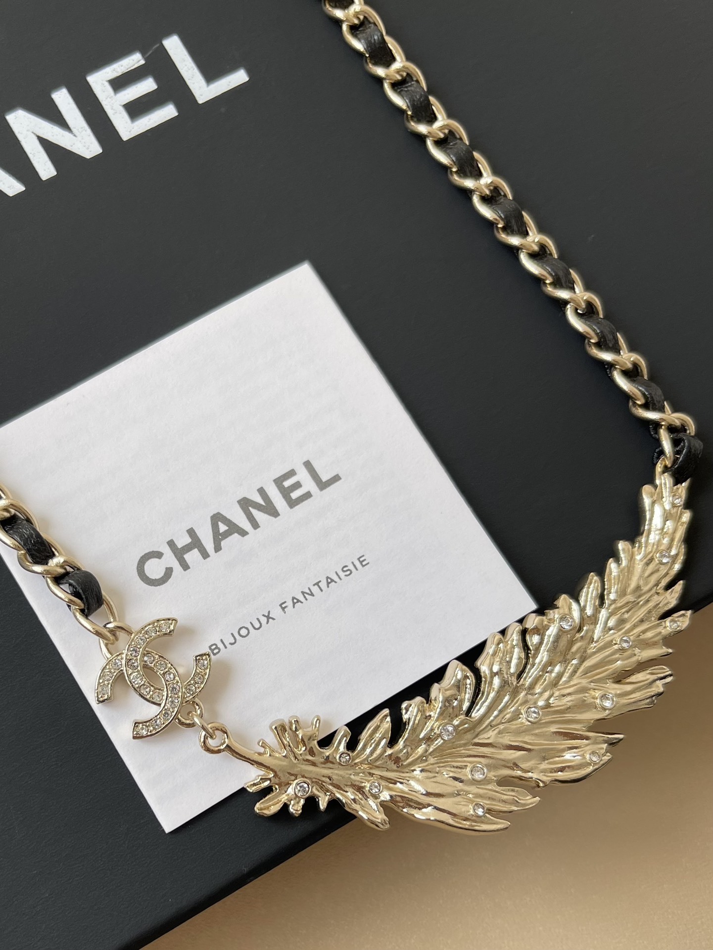 Luxury Gold Feather CC Logo Necklace with Interwoven Leather