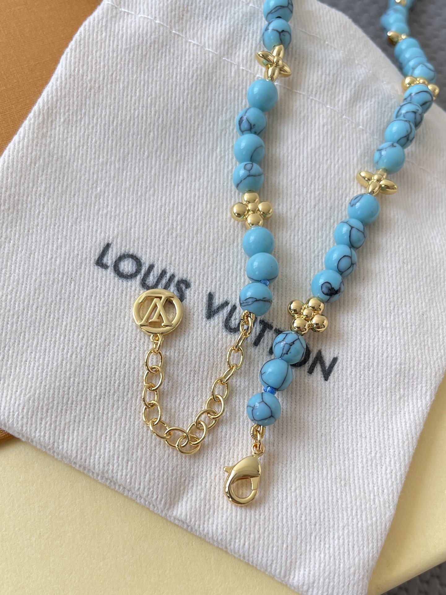 Louis Vuitton Turquoise Beaded Necklace with Gold Monogram Charms