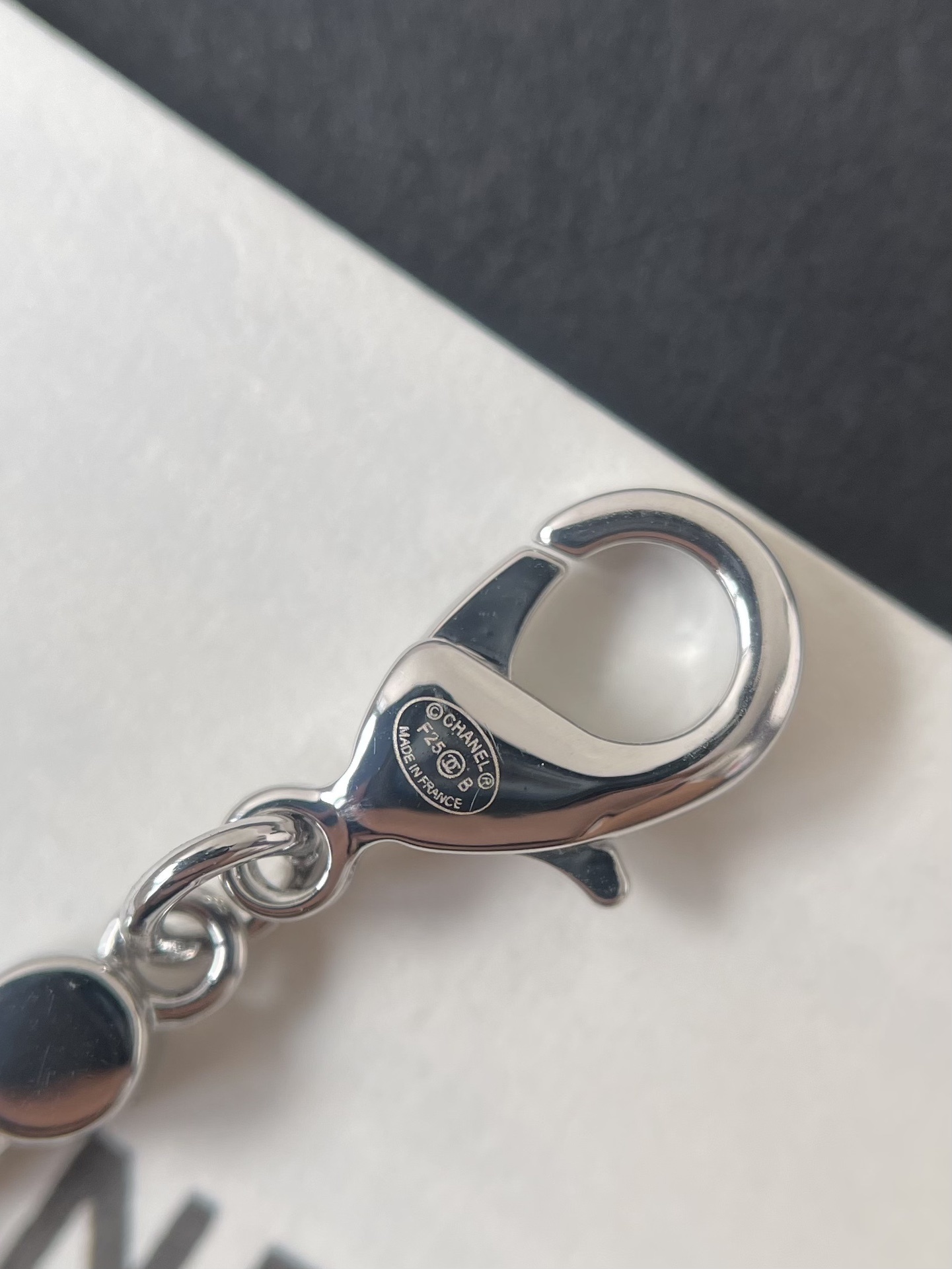 Elegant Silver Pearl Necklace with Sparkling Crystal CC Logo Pendant