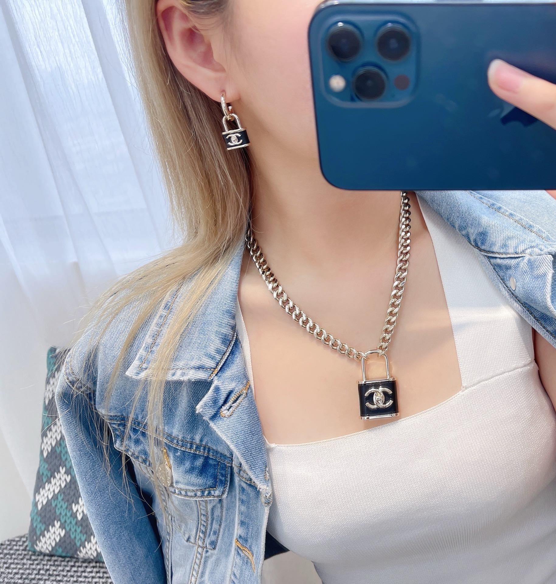 Chanel CC Padlock Necklace - Gold Chain & Black Leather Pendant