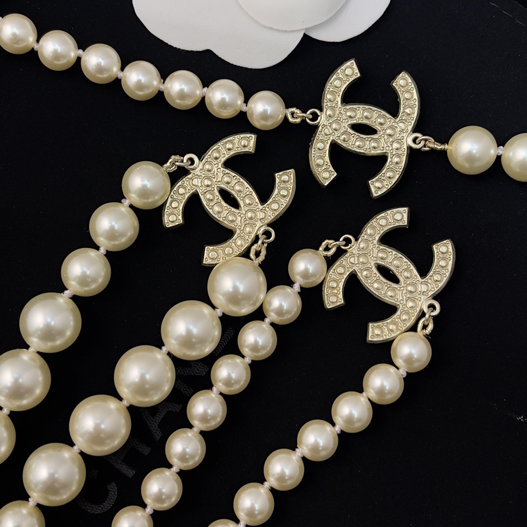 Chanel Elegant Long Pearl Necklace with Embellished CC Logos