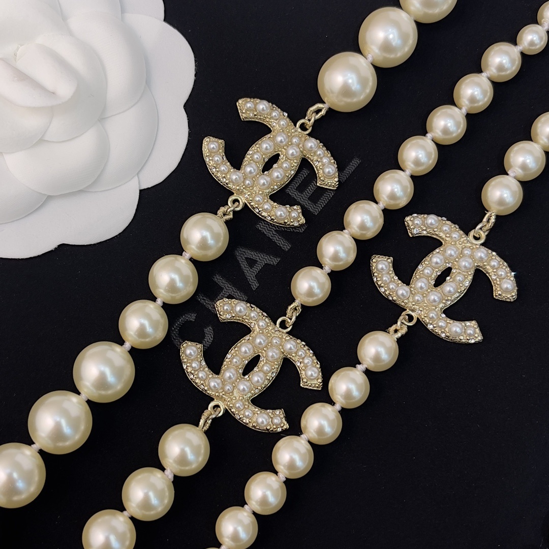 Chanel Elegant Long Pearl Necklace with Embellished CC Logos