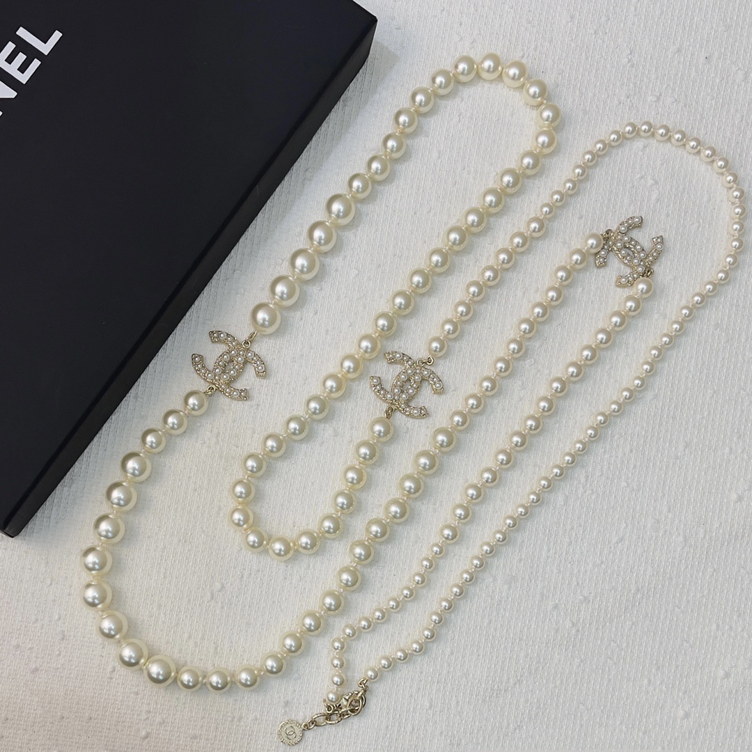 Chanel Elegant Long Pearl Necklace with Embellished CC Logos