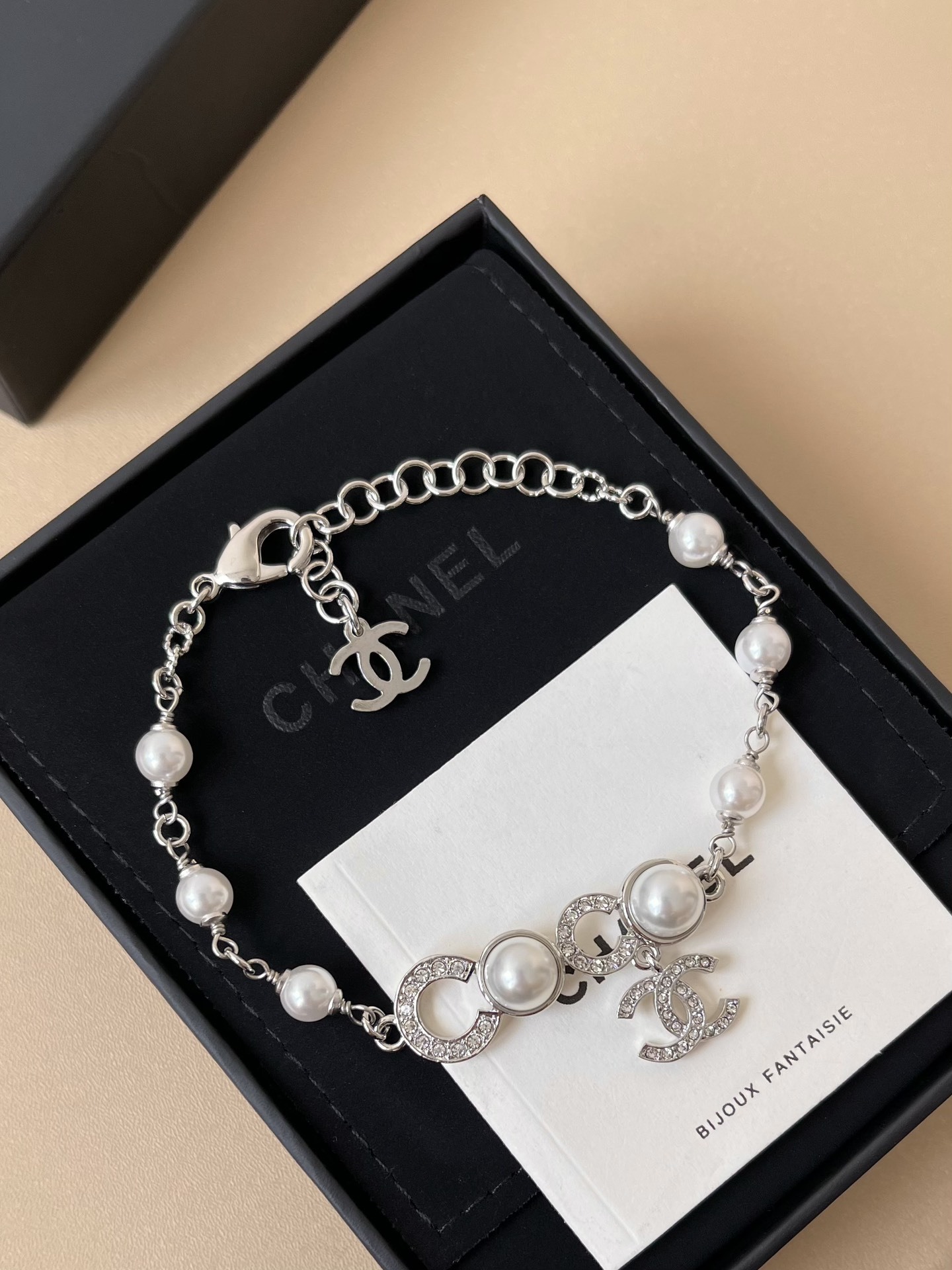 Chanel CC Logo Pearl Bracelet - Silver Metal & Crystal - 2025 Edition